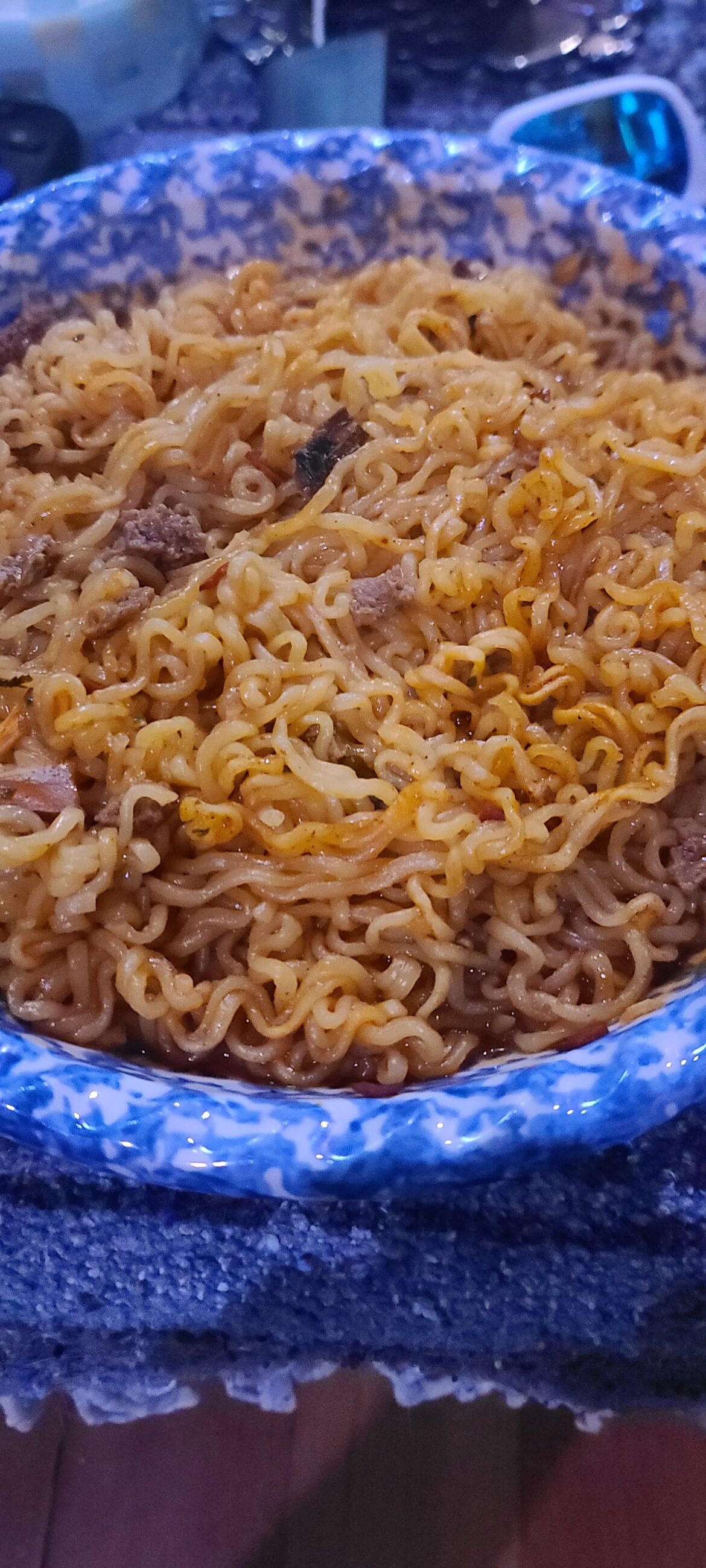 Shin red with ground beef and fresh reaper peppers and onion