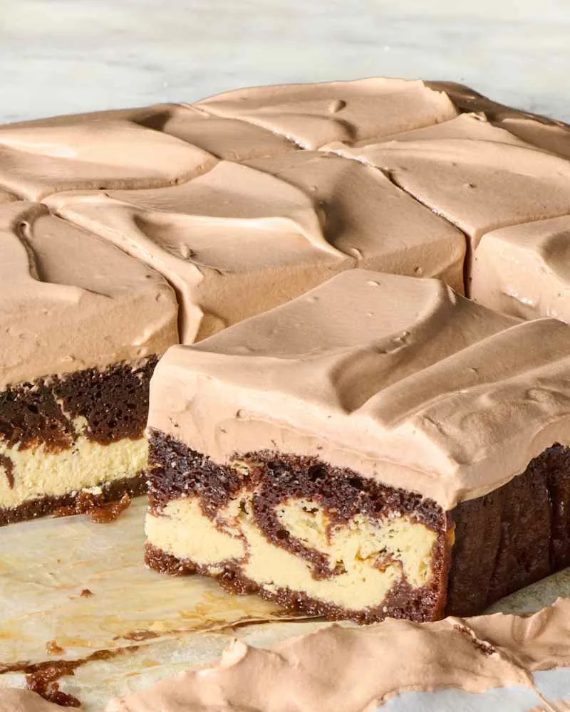 Italian love cake cut up into slices on a piece of parchment paper