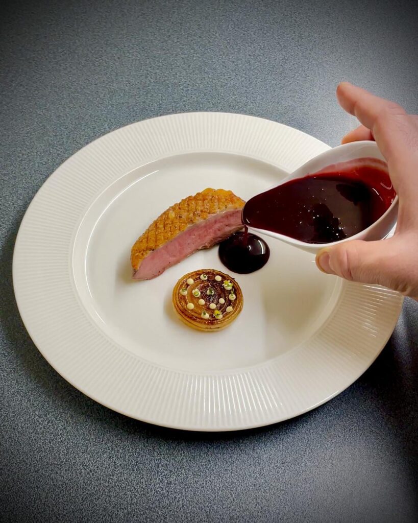 Duck breast, charred onion with miso mayo, blackberry and black garlic sauce