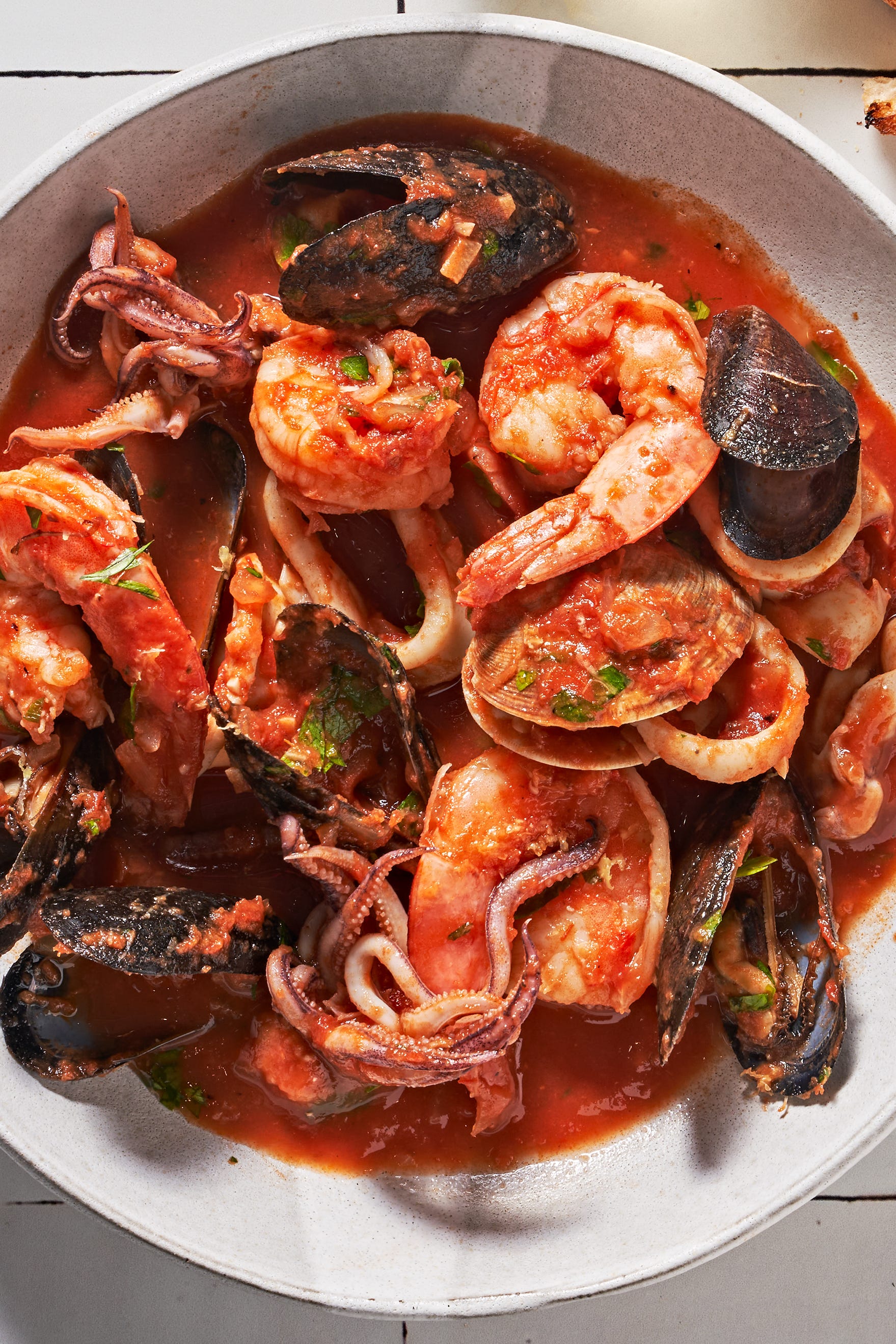 zuppa di pesce with mussels clams shrimp squid tomato white wine andgarlic