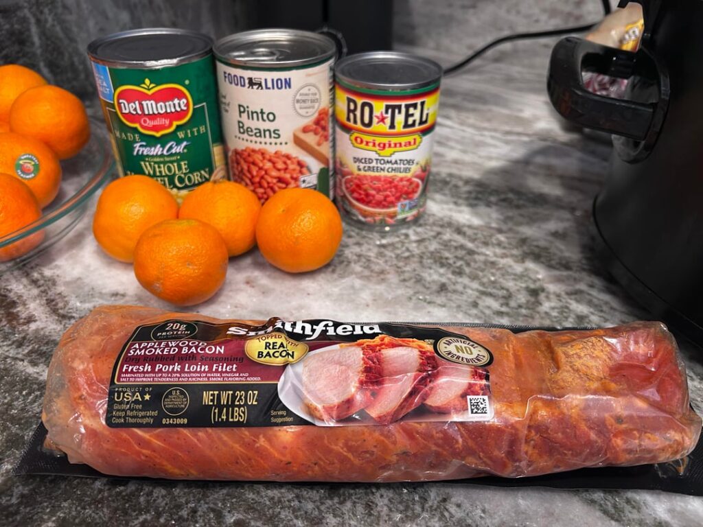 Pork loin, tomato, corn, oranges, and pinto bean soup - seems to be the best name for it.