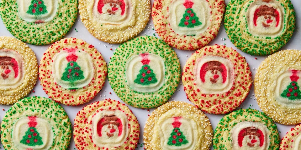 sugar cookie with christmas pillsbury sugar cookies in the middle surrounded by sprinkles