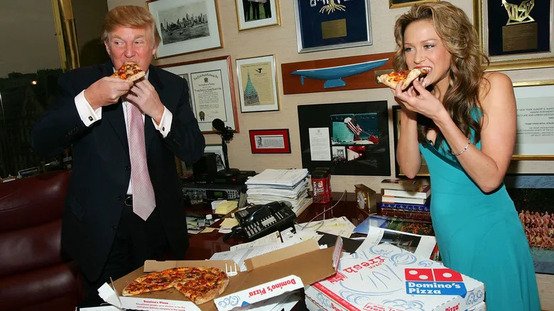 Donald Trump eating pizza with Stephanie Myers
