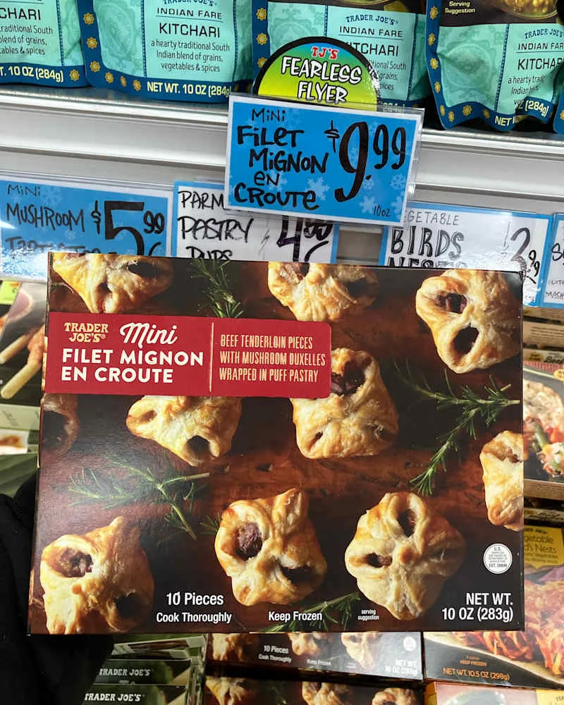 Someone holding package of Trader Joe's Mini Filet Mignon en croute.