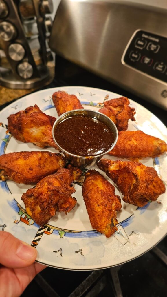 Crispy Air Fryed Black Pepper & Garlic Wings. Home made Super Hot Jerk Sauce with Jack Daniels BBQ Sauce. With Butter and Garlic Base. THE JERK DANIELS