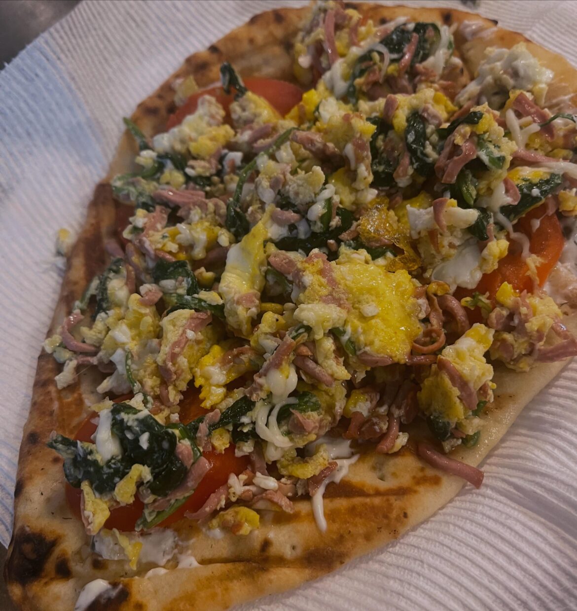 Garlic naan with spinach eggs.