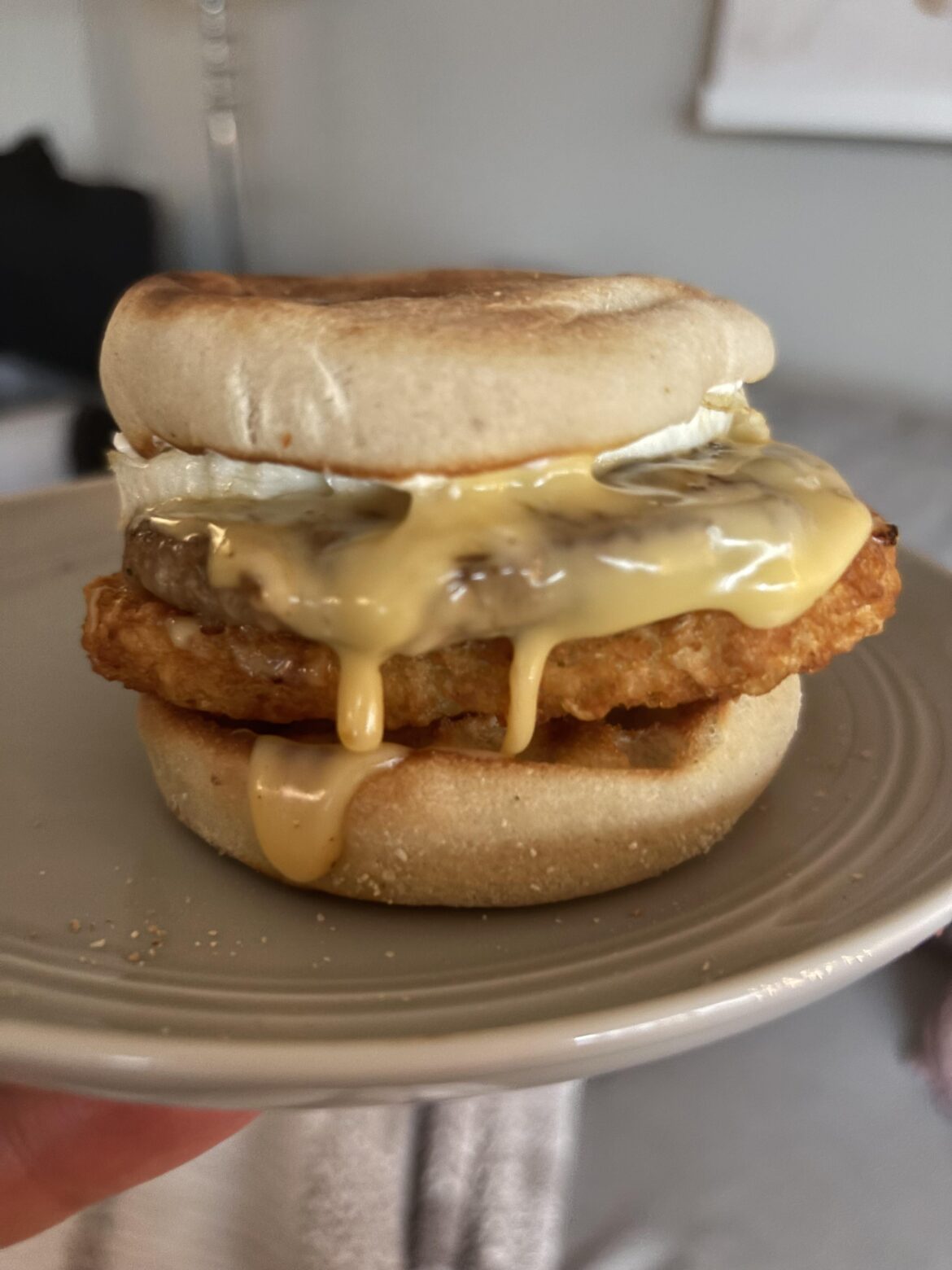 Homemade sausage egg and cheese with a hash brown