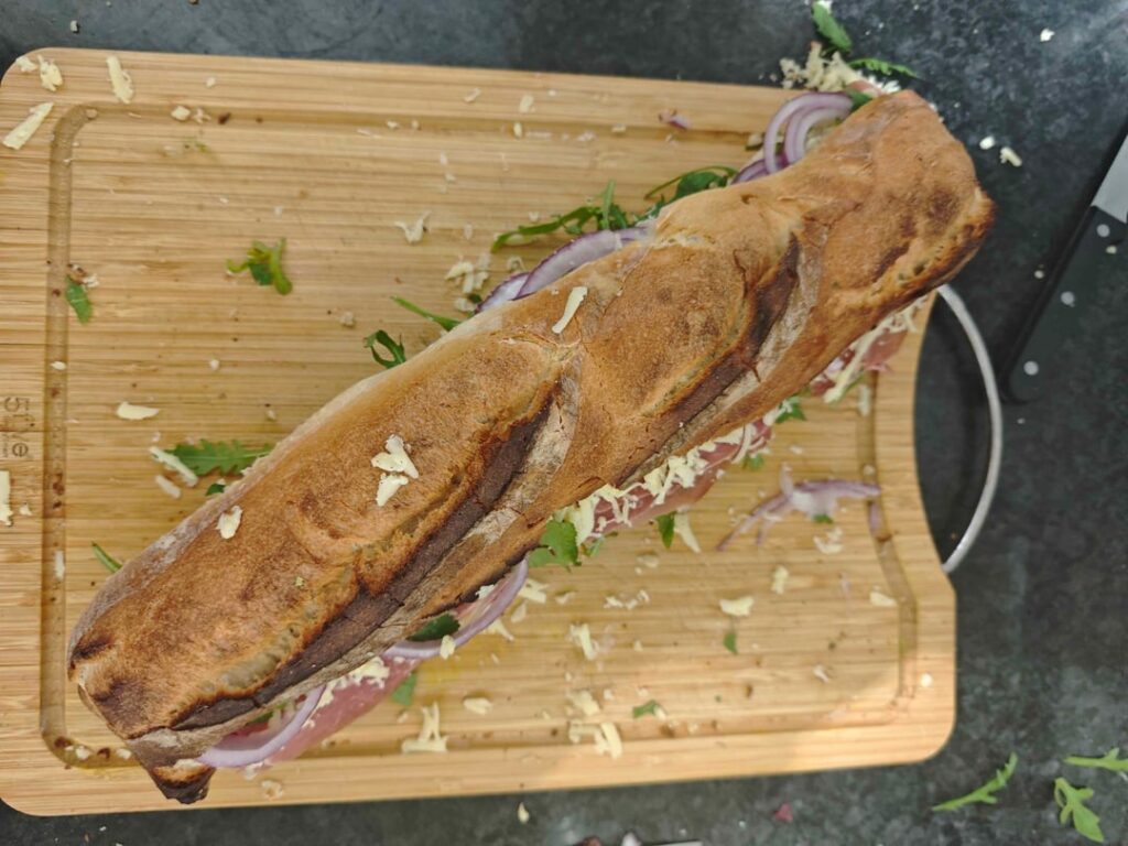 Raw ham, extra mature cheddar and red onion sandwich