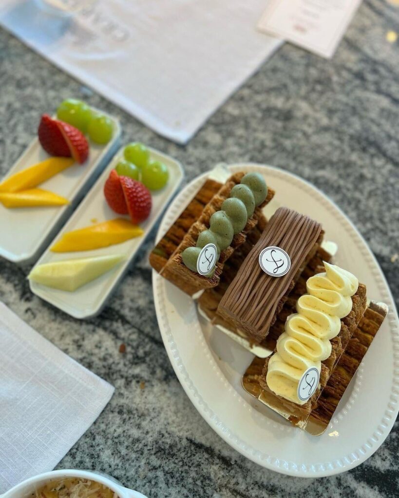 Assorted mille-feuille pastries with pistachio, chocolate, and vanilla