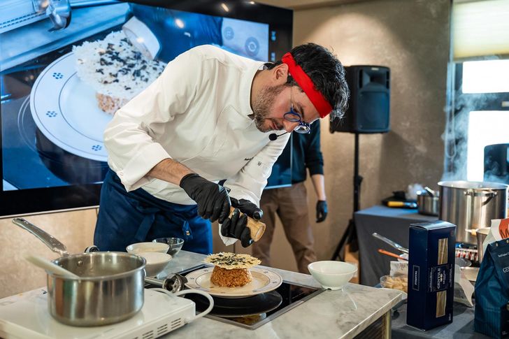 Italian chef Fabrizio Ferrari demonstrates cooking with cheese during  the 'Formaggiamo!' event commemorating the Week of Italian Cuisine in the World, at High Street Italia in southern Seoul in November. Courtesy of Diary R 