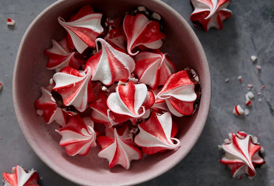 red and white swirled peppermint meringues dipped in chocolate and crushed peppermint