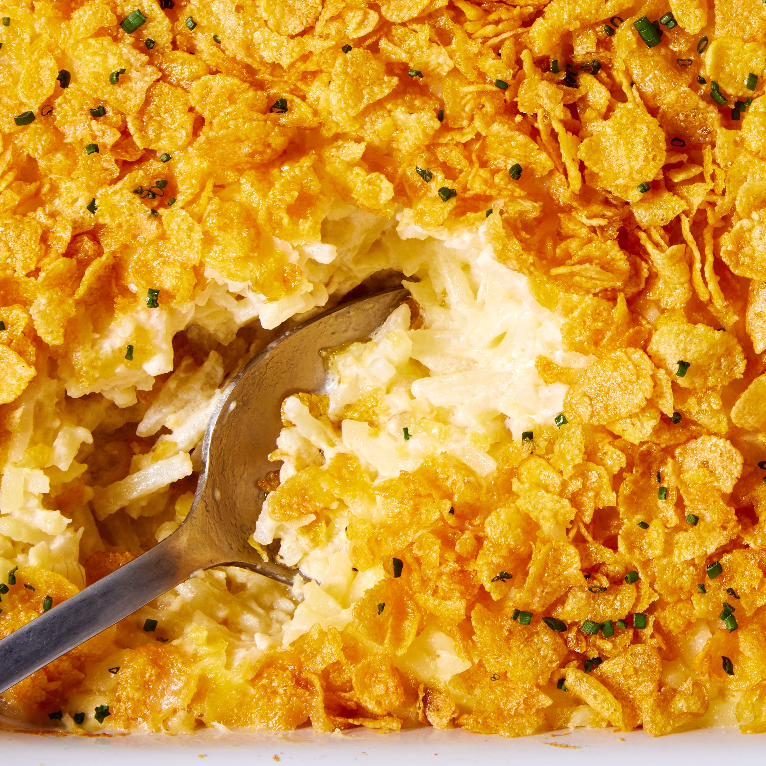 creamy cheesy potatoes with a buttery cornflake topping