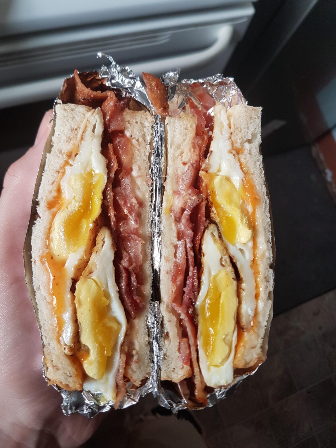 bacon, egg, tomato, and cheese sammy