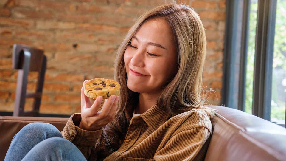 girl eating cookie.