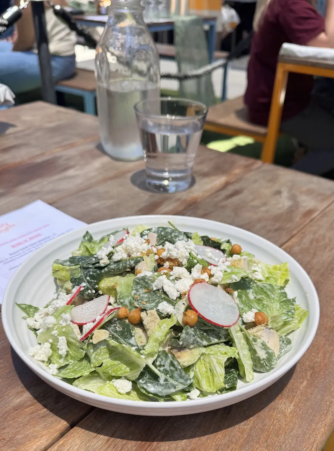 Food from San Diego restaurant Gravity Heights in Mission Valley featuring their Lemon Chicken & Kale Salad