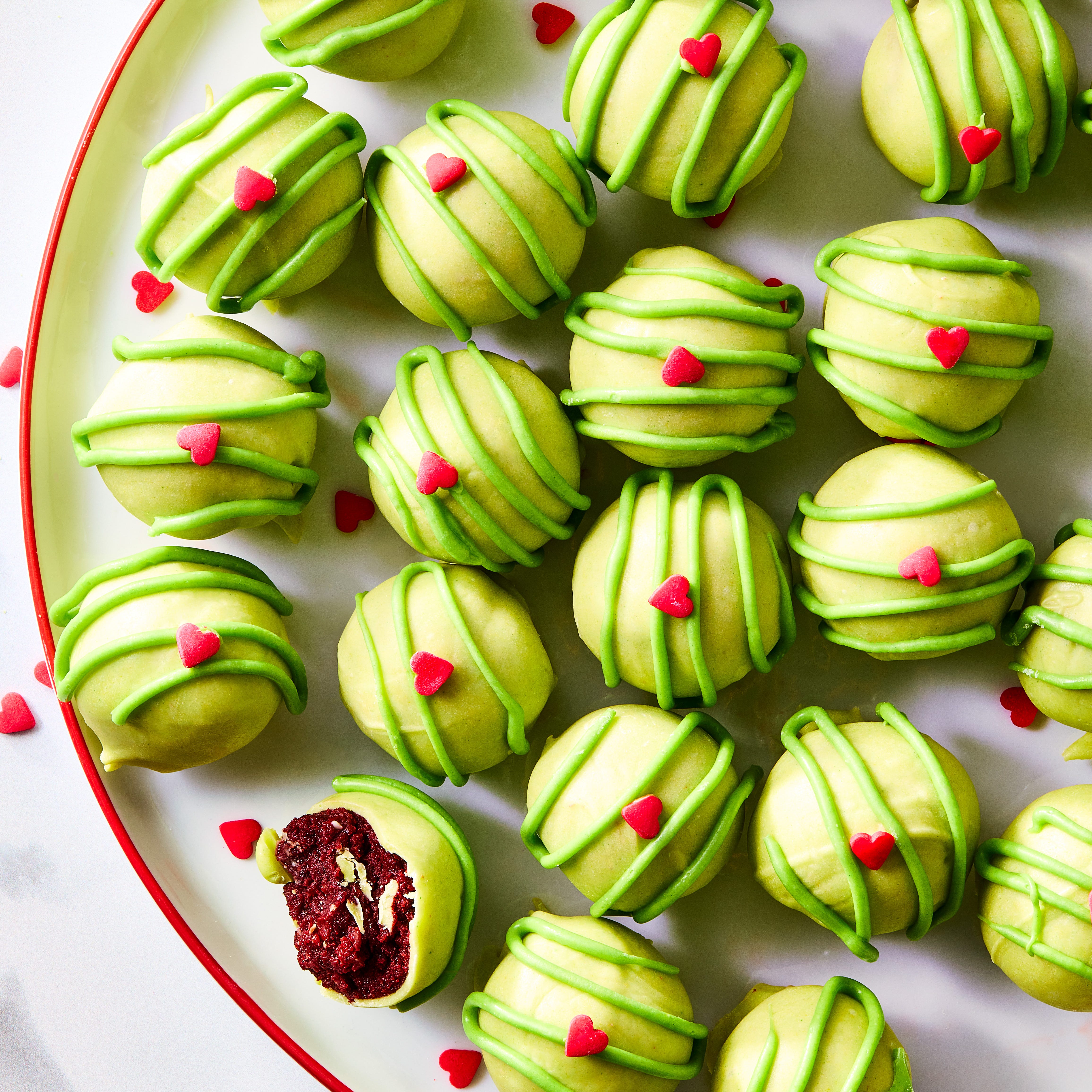green covered cake bites with red hearts