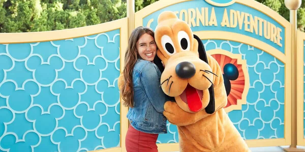 Guest with Pluto at Disney California Adventure