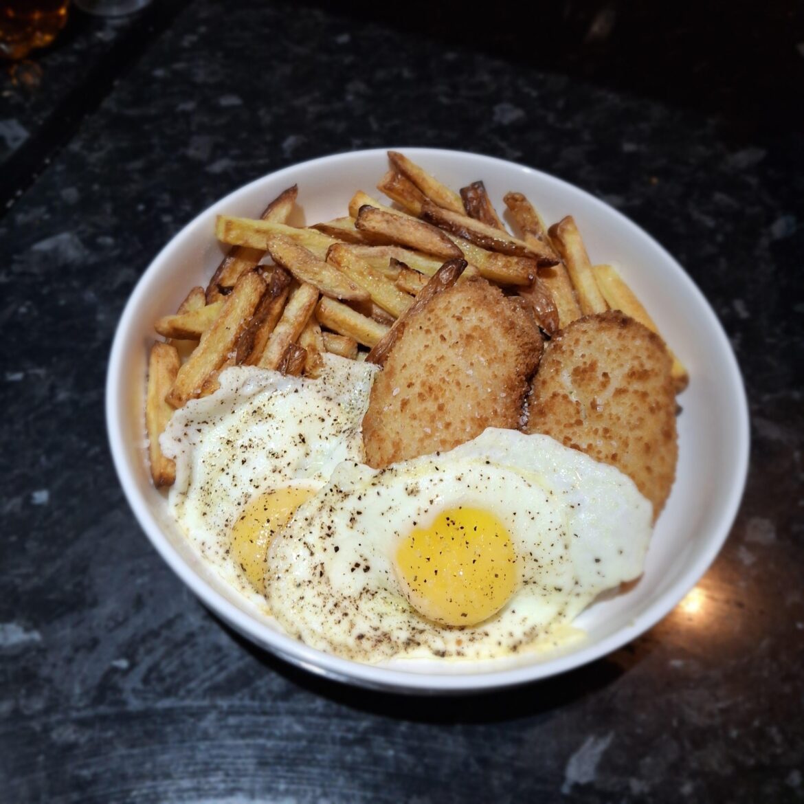 Chicken Kiev, chips and egg.