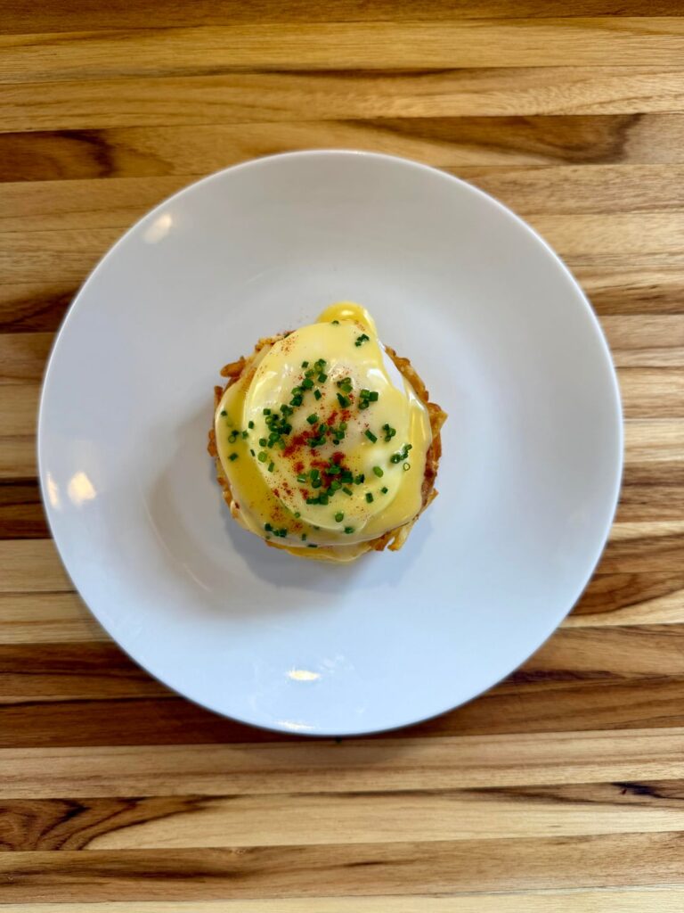 Eggs Benedict over hash browns