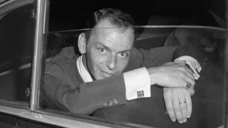 Frank Sinatra sitting in a car