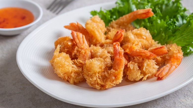 Fried shrimp on a white plate.