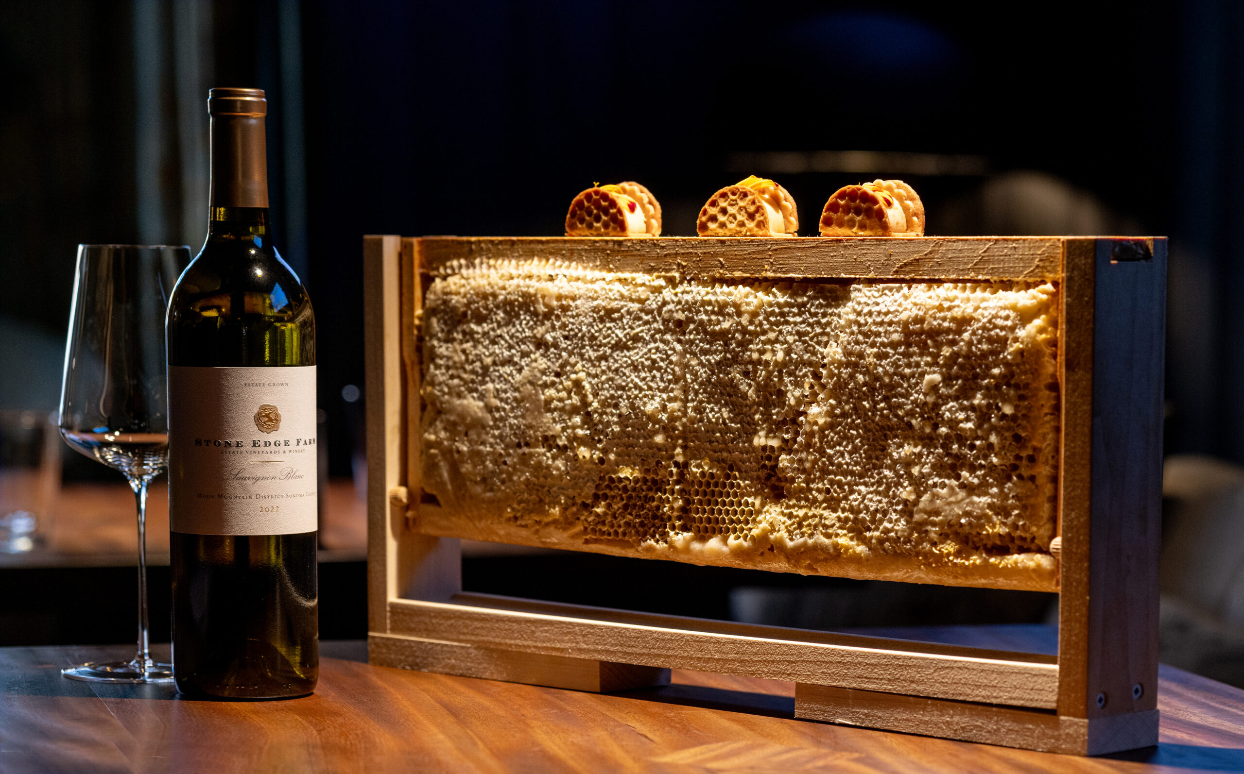 Honey and Chestnut Ice Cream Sandwiches served atop a honeycomb from the multicourse tasting menu at Enclos in Sonoma, Thursday, Jan. 16, 2025. (John Burgess / The Press Democrat)