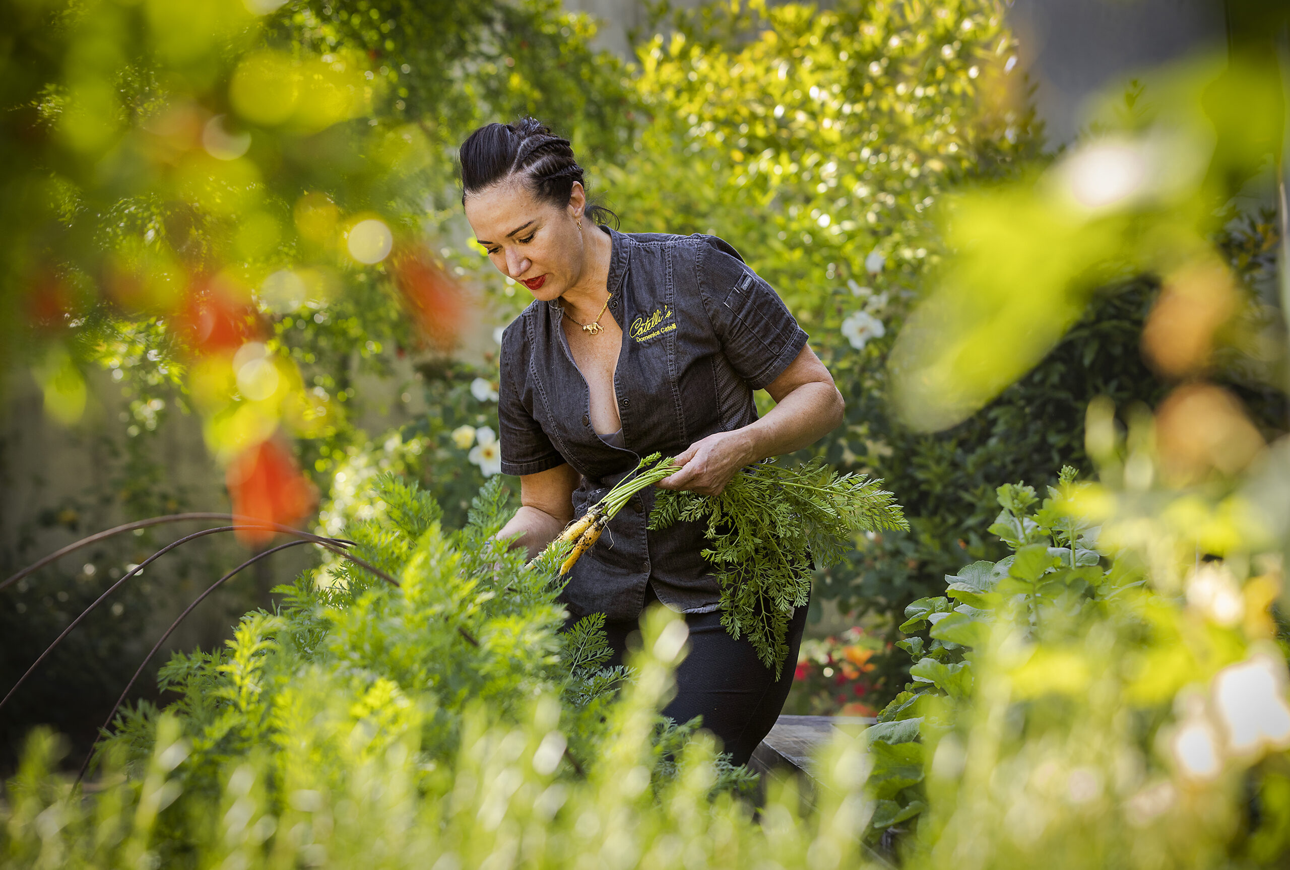 Chef Domenica Catelli picking vegetables from the garden
