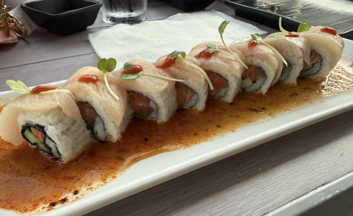 Yellowtail on spicy tuna roll