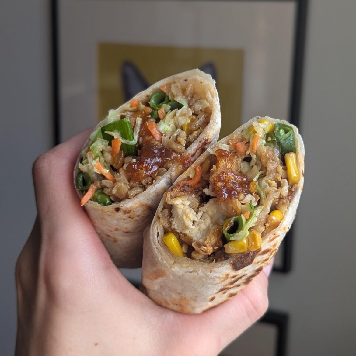 orange chicken and fried rice grilled burrito with sesame ginger slaw.