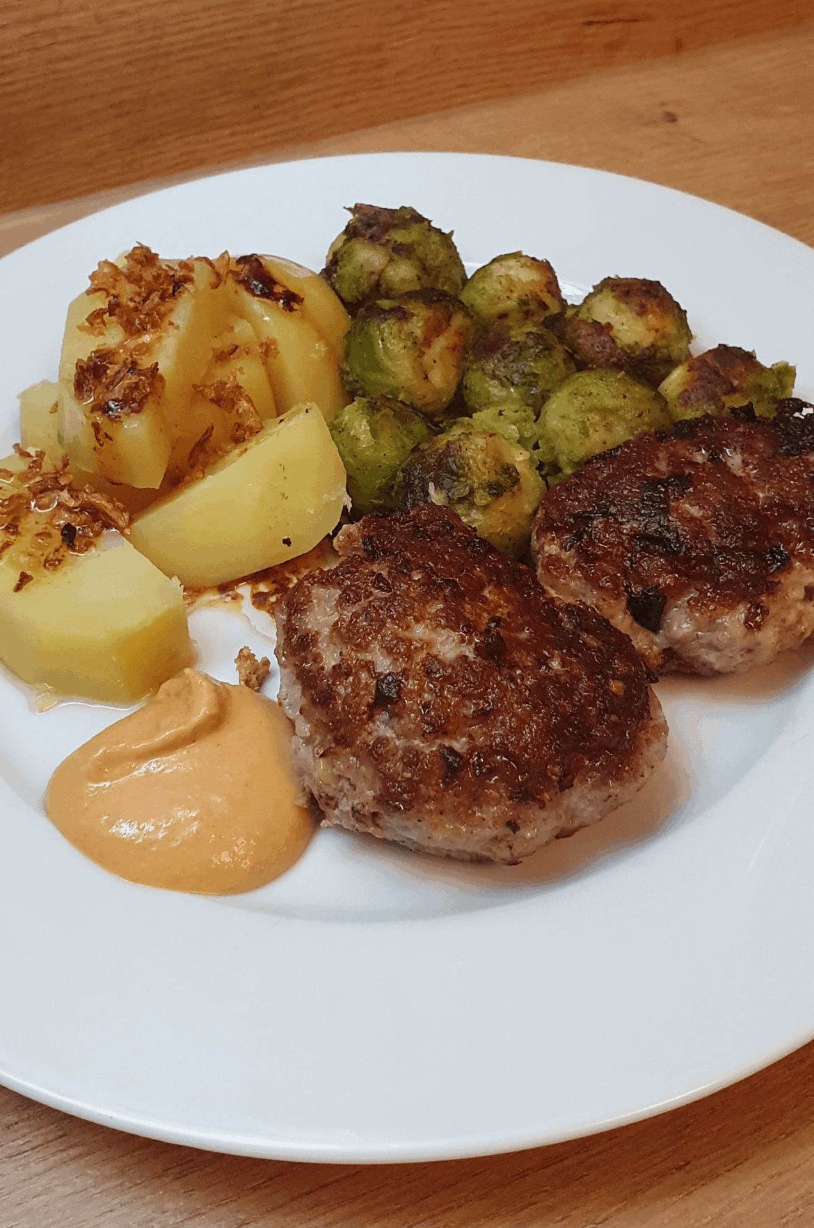 Home-style cooking like Grandma used to make: potatoes, Brussels sprouts, and meatballs