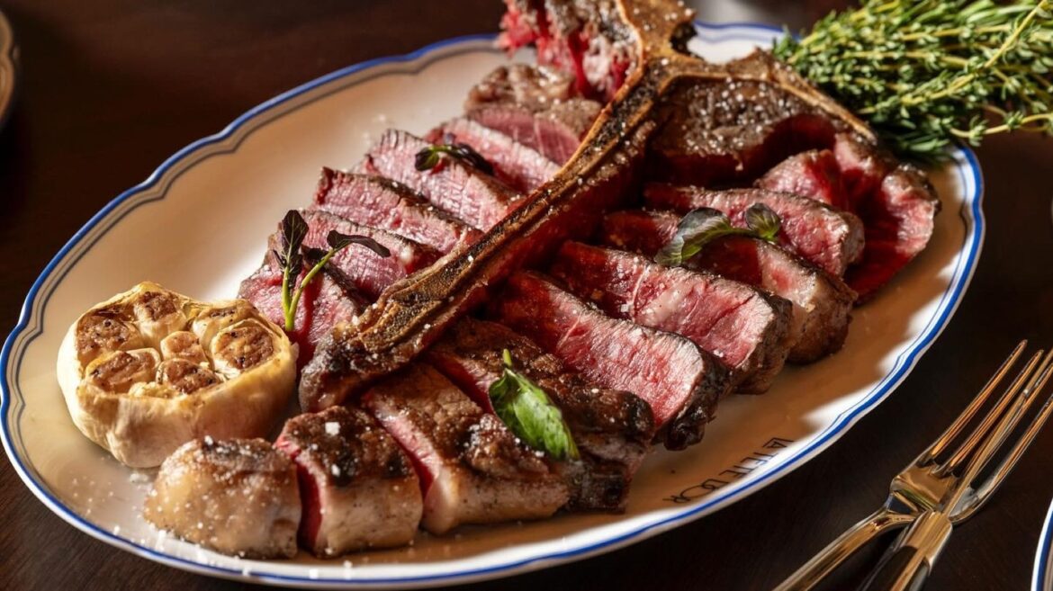 One Of NYC's Top Steakhouses Has An Elegant French Flair Thanks To Its World-Renowned Owner