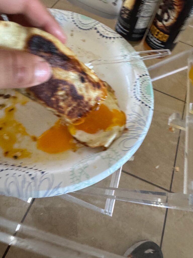 Chorizo and egg burritos and two over ez eggs.