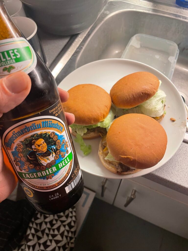 Making cheeseburgers while drinking beer