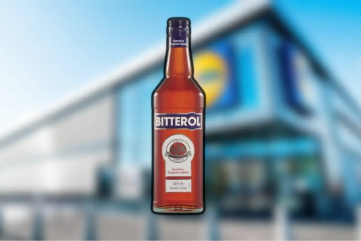 Bitterol liquor bottle in the foreground with a blurred supermarket in the background