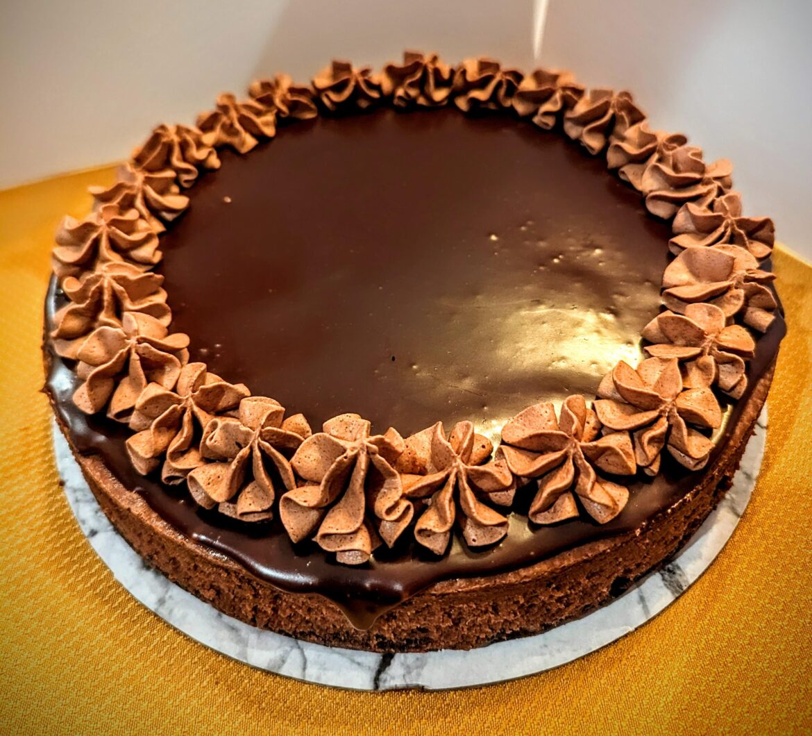 Nutella Chocolate Cheesecake with oreo crust, Semi sweet chocolate ganache and Nutella whipped cream