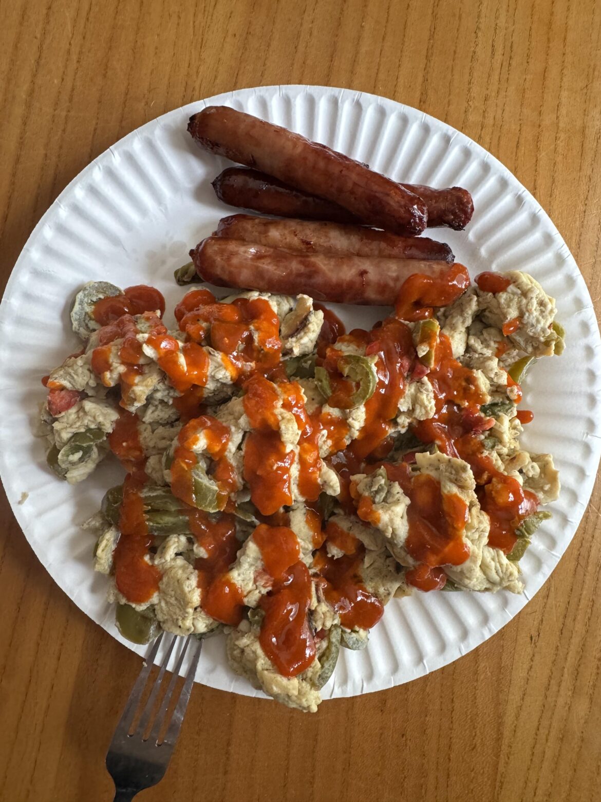 Egg/egg whites scramble with bell peppers, onions, and jalapeños. Side of breakfast sausage. 530kcal
