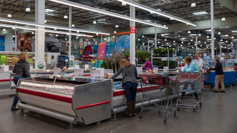 Shoppers browse at a Costco warehouse