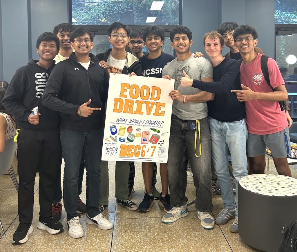 NCSSM students holding a poster for the event
