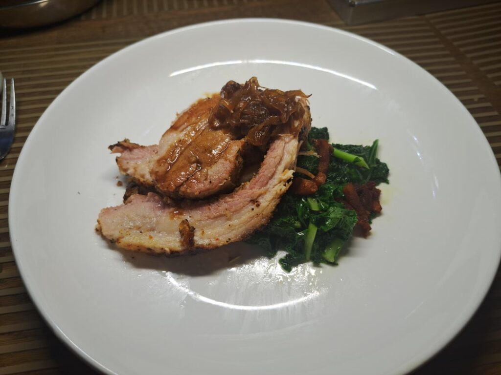 Slow roasted pork belly, sauteéd kale