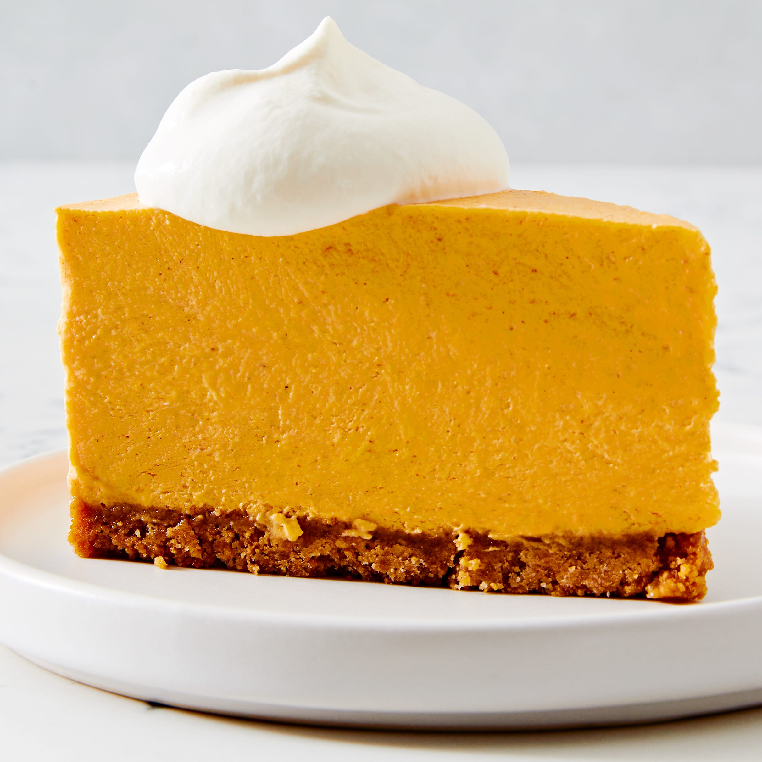 no bake pumpkin cheesecake with whipped cream topping