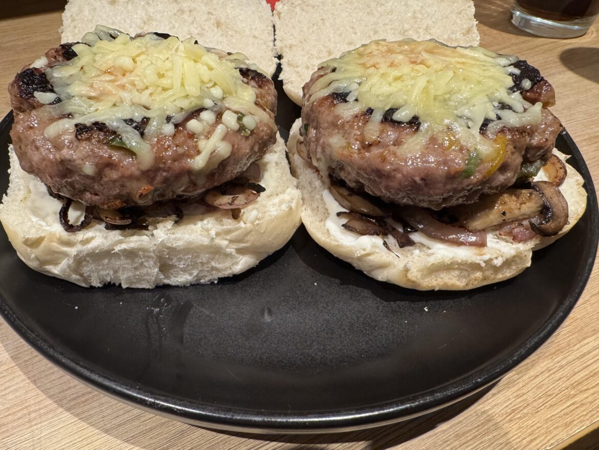 Salt & pepper brisket burgers with pink onions and chestnut mushrooms.