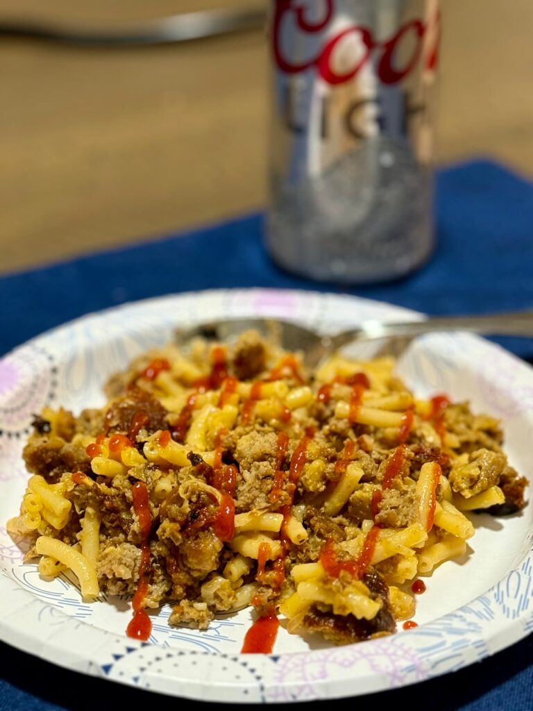 Leftover meatloaf with mac n cheese, sauteed onions and sriracha
