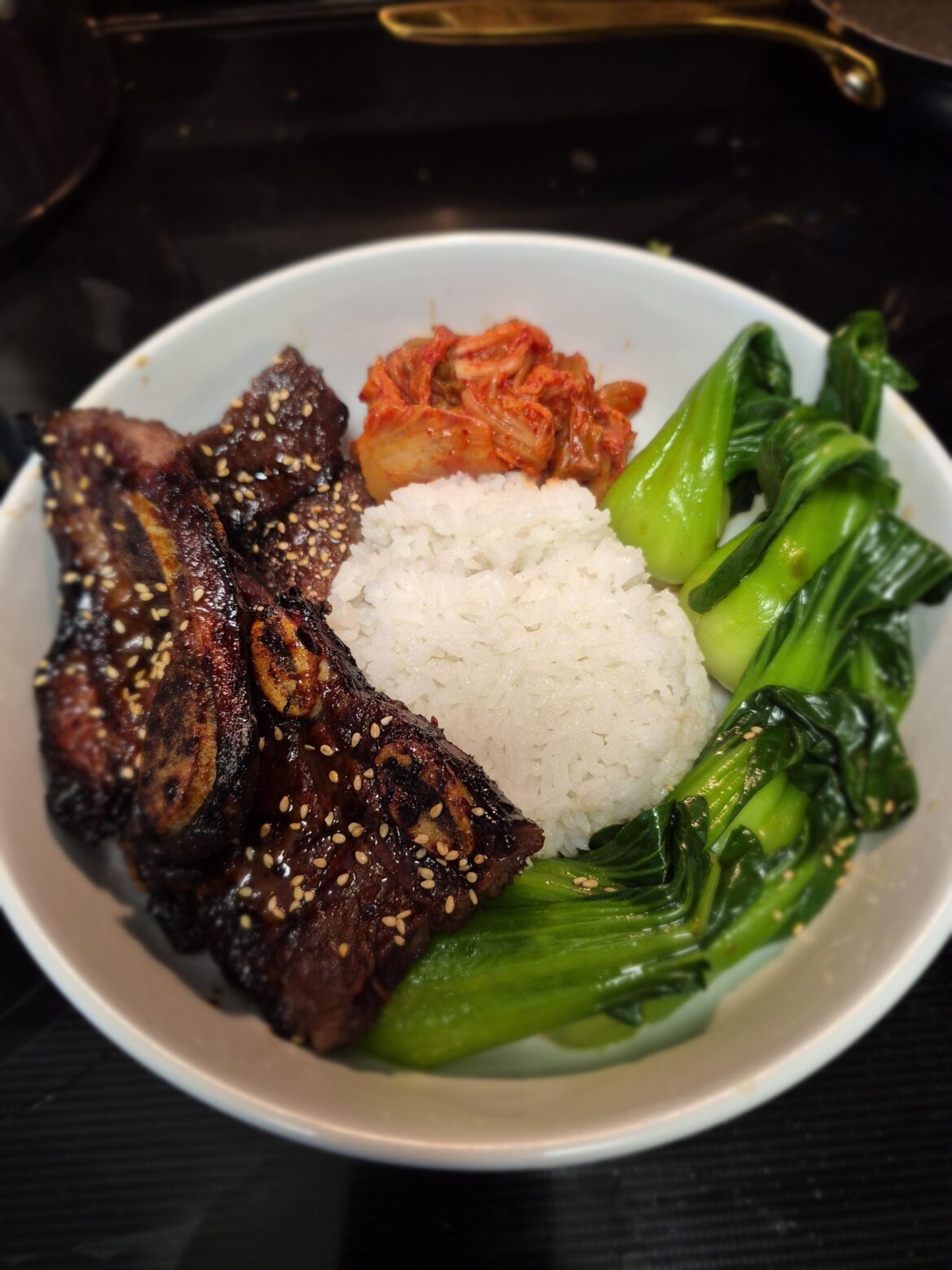 Galbi, bok choy, kimchee, rice
