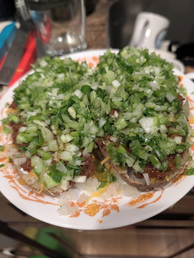 This is what 5 scallions on a chili loaded potato looks like