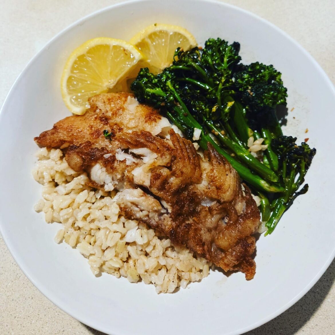 Dover sole, brown rice, and garlicky sautéed broccolini.