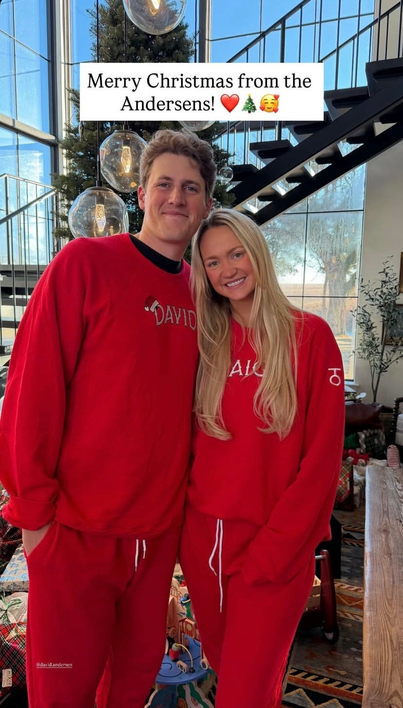 Paige Drummond and David Andersen smiling in front of a decorated Christmas tree on the ranch paige drummond and david andersen smiling in front of a decorated christmas tree on the ranch
