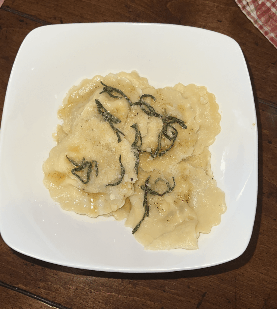 homemade ravioli filled with burrata, ricotta, parm and caramelized onion