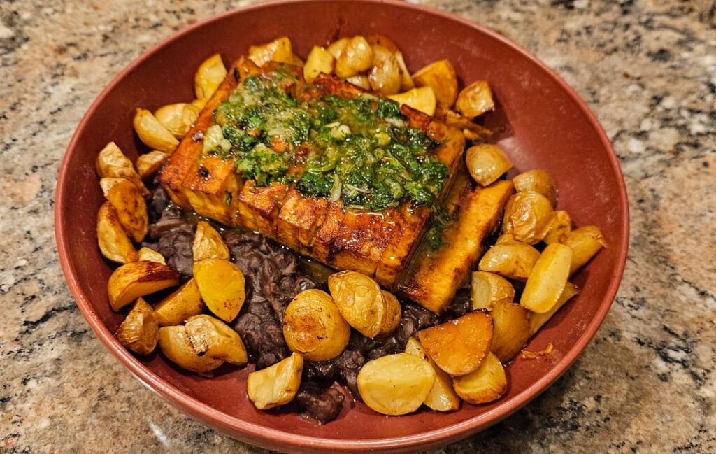 First post here. Hassleback tofu with chimi, roasted potatoes, sauteed black beans.