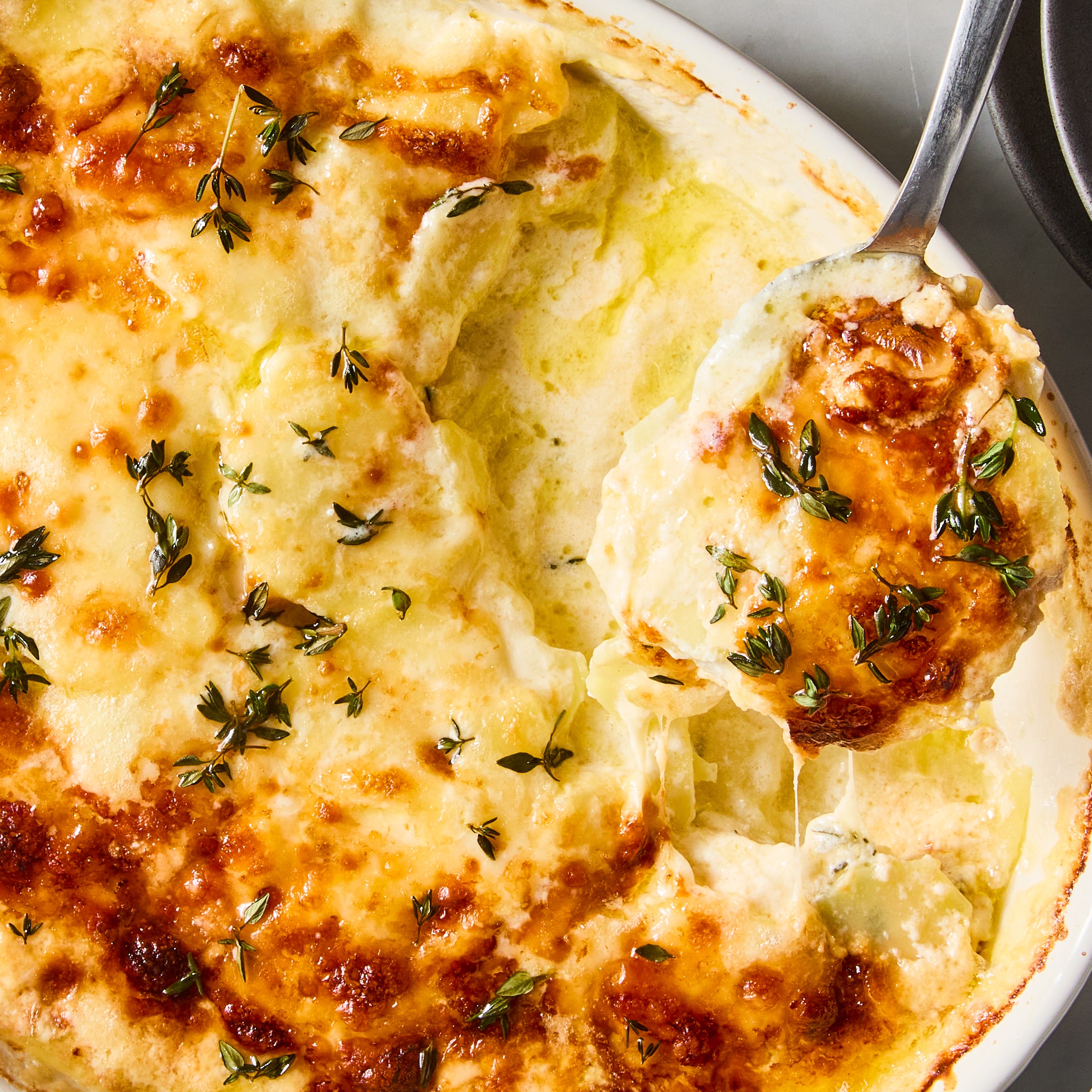 potatoes au gratin topped with thyme
