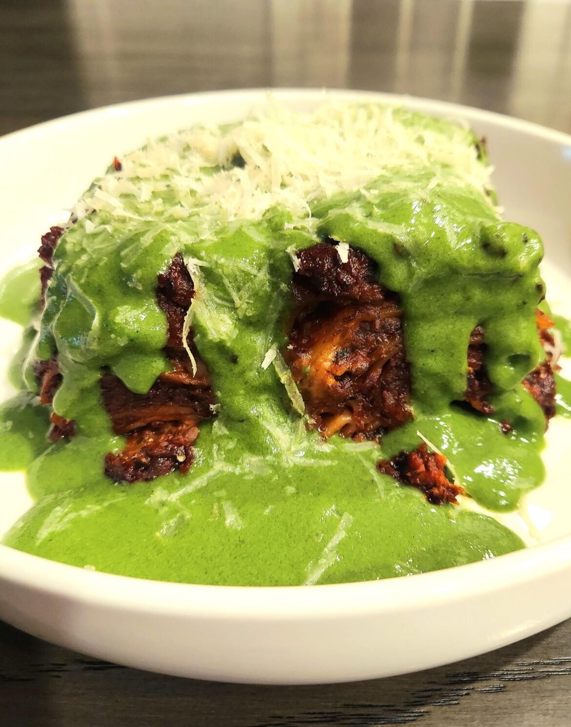 Lasagna bolognese with a spinach bechamel